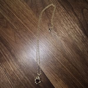 Gold Necklace with reddish purple stone